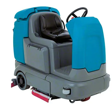 blue and grey ride on floor scrubber by tennant